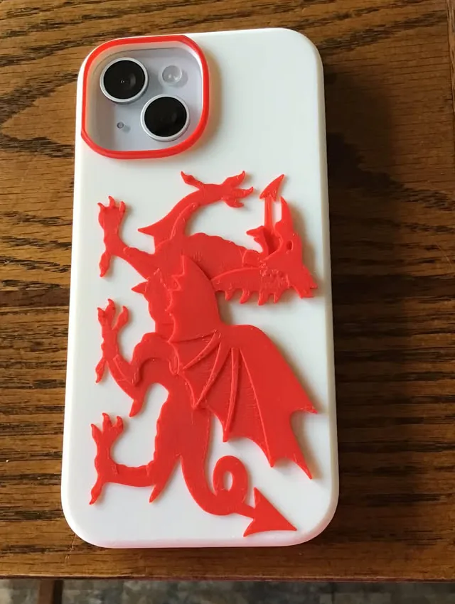 White 3D-printed phone case with a raised red Welsh dragon and red camera surround